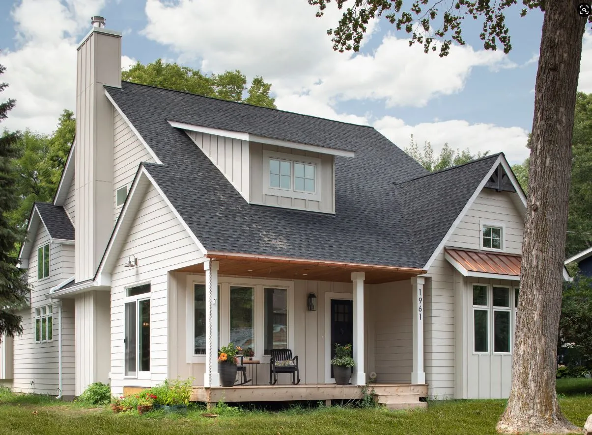 Craftsman-inspired exterior with layered rooflines and covered front porch.